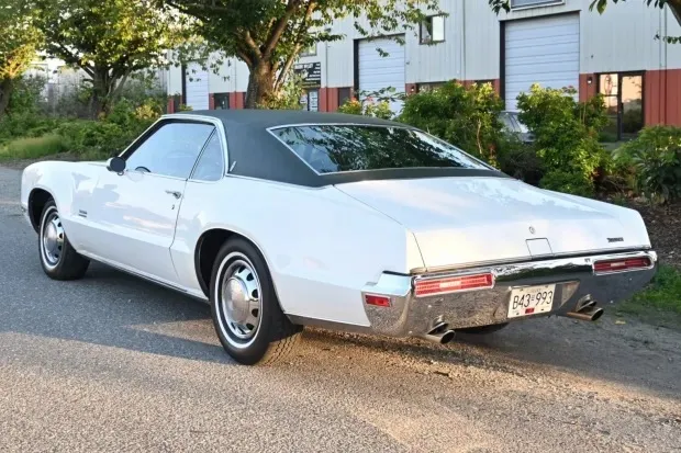 White Oldsmobile Toronado photographed from the rear after service