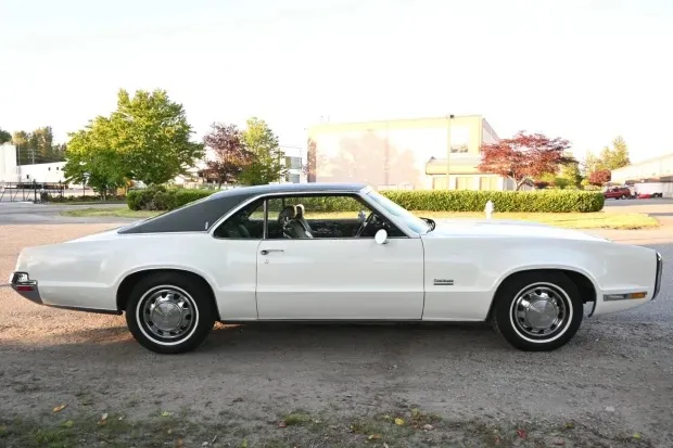 White Oldsmobile Toronado side profile serviced on location