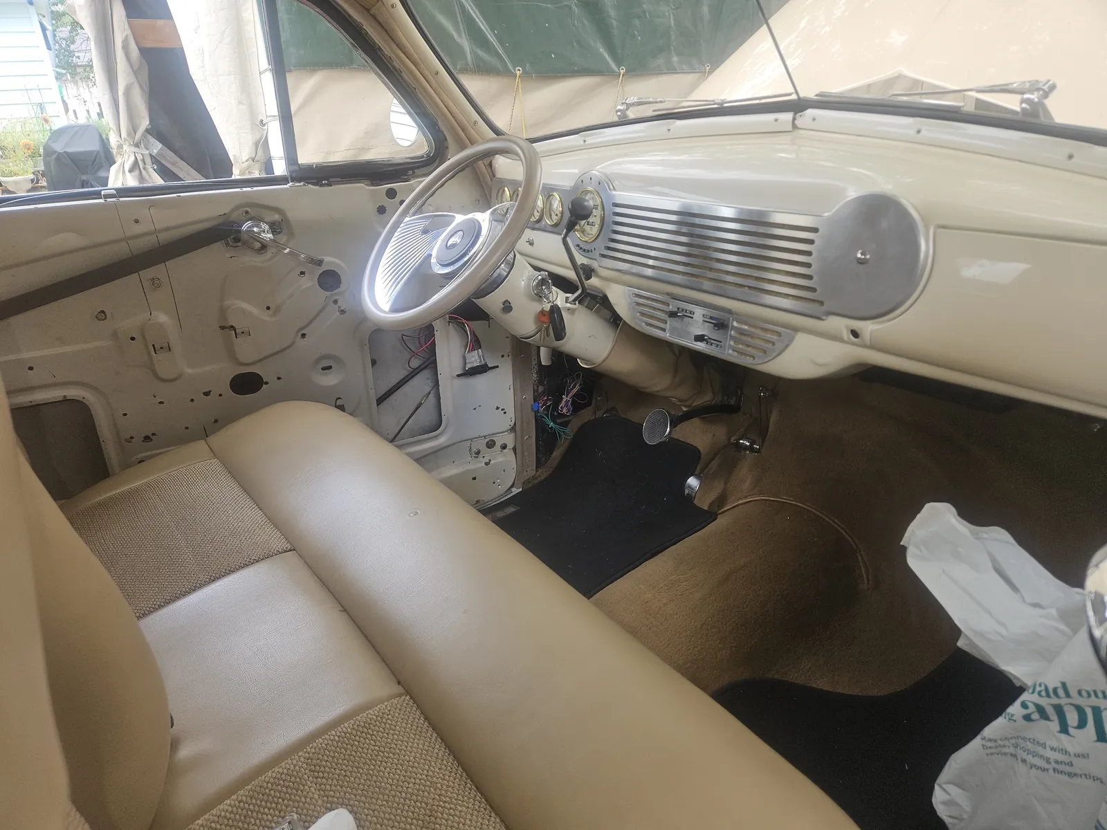 Interior and dash of a 1941 Chevrolet during a complete gauge and wiring rebuild